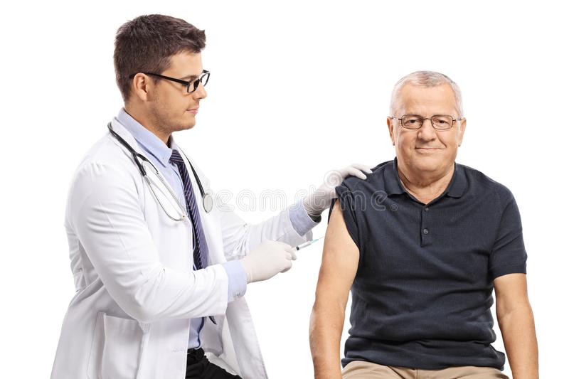 doctor giving shot to patient